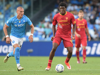 Patrick Dorgu of US Lecce competes for the ball with Leo Ostigard of SSC Napoli during the Serie A TIM match between SSC Napoli and US Lecce...
