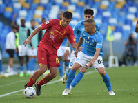 Medon Berisha of US Lecce competes for the ball with Stanislav Lobotka of SSC Napoli during the Serie A TIM match between SSC Napoli and US...