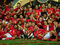 Al-Ahly club players are celebrating the cup on the podium at Cairo International Stadium in Cairo, Egypt, on May 25, 2024. (