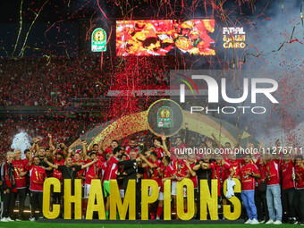 Al-Ahly club players are celebrating the cup on the podium at Cairo International Stadium on May 25, 2024, in Cairo, Egypt. (