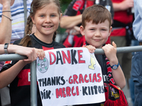 People are waiting for the team of Bayer 04 Leverkusen to arrive at Bay Arena Stadium in Leverkusen, Germany, on May 26, 2024. (