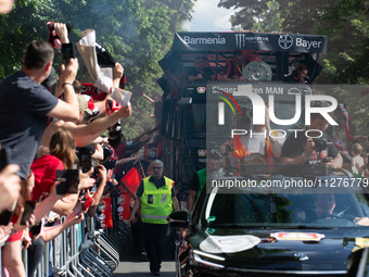 A team of Bayer 04 Leverkusen is arriving with an open bus to celebrate with the fans on the way to Bay Arena Stadium in Leverkusen, Germany...