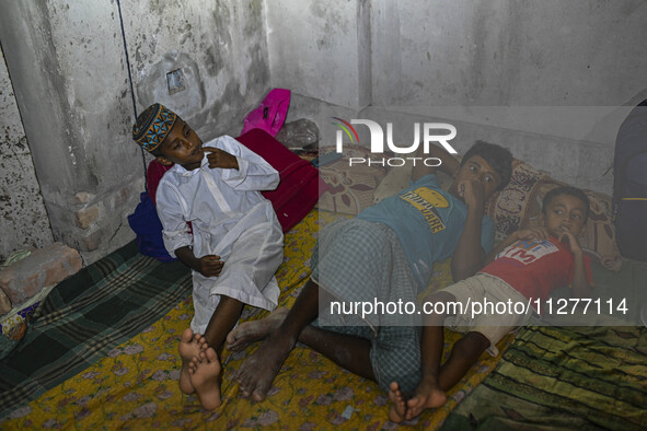 Bangladeshi children are taking shelter in the Cyclone Shelter in Kuakata, Bangladesh, on May 26, 2024, ahead of Cyclone Remal's landfall in...