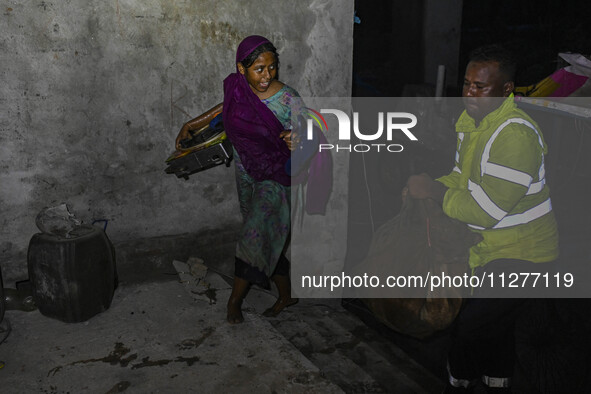 Bangladesh Naval Police members are helping local people take shelter in the Cyclone Shelter in Kuakata, Bangladesh, on May 26, 2024, ahead...