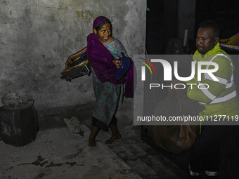 Bangladesh Naval Police members are helping local people take shelter in the Cyclone Shelter in Kuakata, Bangladesh, on May 26, 2024, ahead...