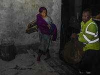 Bangladesh Naval Police members are helping local people take shelter in the Cyclone Shelter in Kuakata, Bangladesh, on May 26, 2024, ahead...