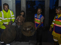 Bangladesh Naval Police members are helping local people take shelter in the Cyclone Shelter in Kuakata, Bangladesh, on May 26, 2024, ahead...