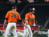 Oklahoma State's Kollin Ritchie #13 is high-fiving his coach Josh Holliday during the 2024 Big 12 Baseball Championship game between the Okl...