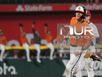 Oklahoma State catcher Ian Daugherty #8 is running around the bases during the 2024 Big 12 Baseball Championship game between the Oklahoma S...