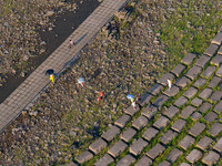 Citizens are playing on the beach of the Jialing River as the water level drops in Chongqing, China, on May 26, 2024. (