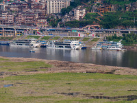 Citizens are playing on the beach of the Jialing River as the water level drops in Chongqing, China, on May 26, 2024. (