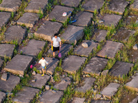 Citizens are playing on the beach of the Jialing River as the water level drops in Chongqing, China, on May 26, 2024. (