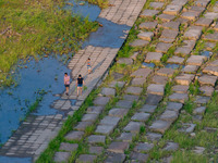 Citizens are playing on the beach of the Jialing River as the water level drops in Chongqing, China, on May 26, 2024. (