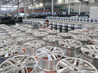 A worker is producing a wheel hub at a workshop of an automobile wheel manufacturer in Binzhou, China, on May 27, 2024. (