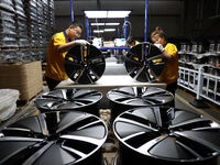 Workers are producing wheels at a workshop of an automobile wheel manufacturer in Binzhou, China, on May 27, 2024. (