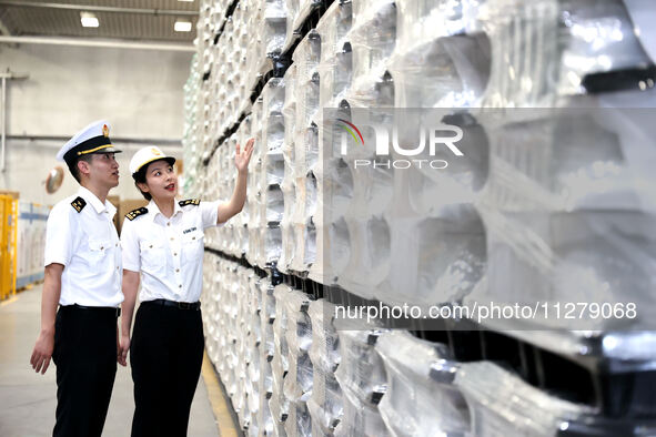 Customs officers are inspecting products about to be exported in a workshop of an automobile wheel manufacturer in Binzhou, China, on May 27...