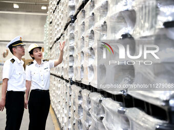 Customs officers are inspecting products about to be exported in a workshop of an automobile wheel manufacturer in Binzhou, China, on May 27...