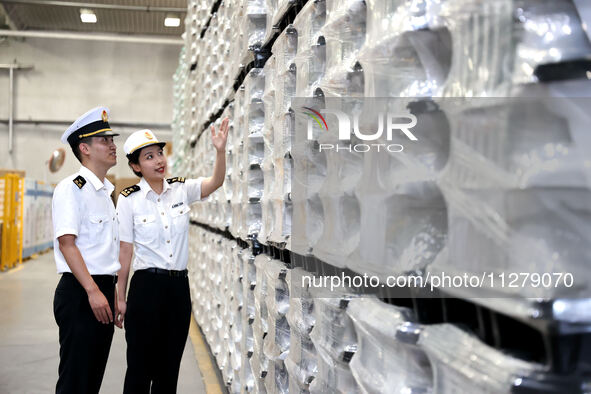 Customs officers are inspecting products about to be exported in a workshop of an automobile wheel manufacturer in Binzhou, China, on May 27...