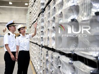 Customs officers are inspecting products about to be exported in a workshop of an automobile wheel manufacturer in Binzhou, China, on May 27...