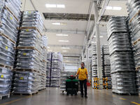 A worker is producing a wheel hub at a workshop of an automobile wheel manufacturer in Binzhou, China, on May 27, 2024. (