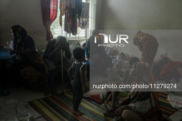 People are taking shelter in a school as Cyclone Remal is landing in Satkhira, Bangladesh, on May 27, 2024 