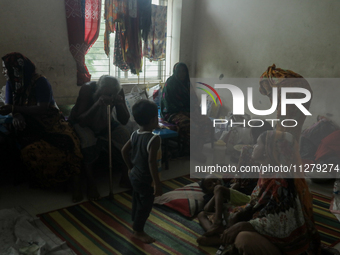 People are taking shelter in a school as Cyclone Remal is landing in Satkhira, Bangladesh, on May 27, 2024 (