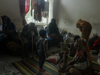 People are taking shelter in a school as Cyclone Remal is landing in Satkhira, Bangladesh, on May 27, 2024 (