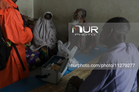 People are taking shelter in a school as Cyclone Remal is landing in Satkhira, Bangladesh, on May 27, 2024 