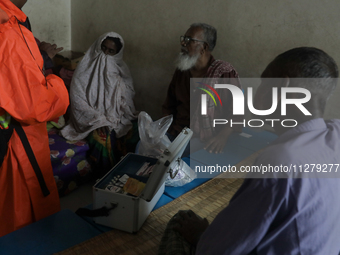 People are taking shelter in a school as Cyclone Remal is landing in Satkhira, Bangladesh, on May 27, 2024 (