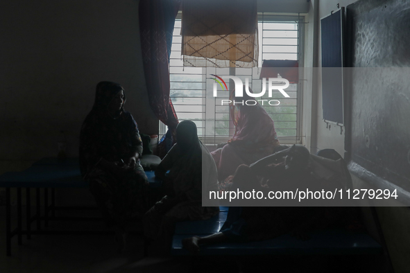 People are taking shelter in a school as Cyclone Remal is landing in Satkhira, Bangladesh, on May 27, 2024 