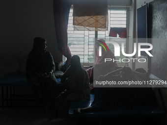 People are taking shelter in a school as Cyclone Remal is landing in Satkhira, Bangladesh, on May 27, 2024 (