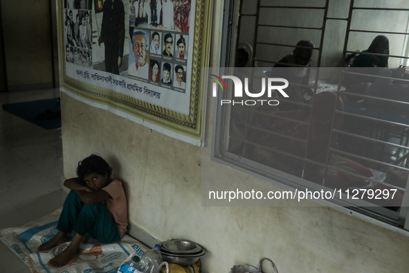 People are taking shelter in a school as Cyclone Remal is landing in Satkhira, Bangladesh, on May 27, 2024 