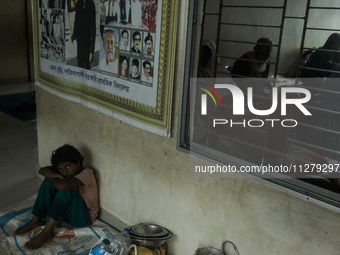 People are taking shelter in a school as Cyclone Remal is landing in Satkhira, Bangladesh, on May 27, 2024 (