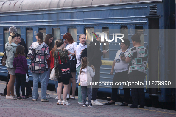 Families with children are evacuating from the frontline areas of Kharkiv region on the train as they go on vacation to western Ukraine with...