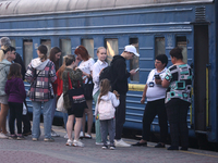 Families with children are evacuating from the frontline areas of Kharkiv region on the train as they go on vacation to western Ukraine with...