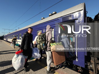 Families with children are evacuating from the frontline areas of Kharkiv region on the train as they go on vacation to western Ukraine with...