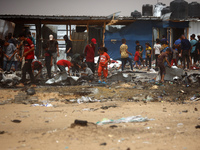 Palestinians are gathering at the site of an Israeli strike on a camp for internally displaced people in Rafah, on May 27, 2024, amid ongoin...