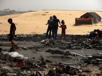 Palestinians are gathering at the site of an Israeli strike on a camp for internally displaced people in Rafah, on May 27, 2024, amid ongoin...