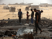 Palestinians are gathering at the site of an Israeli strike on a camp for internally displaced people in Rafah, on May 27, 2024, amid ongoin...