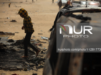 Palestinians are gathering at the site of an Israeli strike on a camp for internally displaced people in Rafah, on May 27, 2024, amid ongoin...