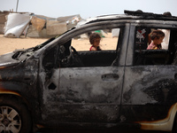 Palestinians are gathering at the site of an Israeli strike on a camp for internally displaced people in Rafah, on May 27, 2024, amid ongoin...