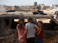 Palestinians are gathering at the site of an Israeli strike on a camp for internally displaced people in Rafah, on May 27, 2024, amid ongoin...