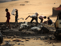 Palestinians are gathering at the site of an Israeli strike on a camp for internally displaced people in Rafah, on May 27, 2024, amid ongoin...