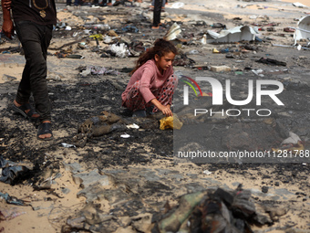 Palestinians are gathering at the site of an Israeli strike on a camp for internally displaced people in Rafah, on May 27, 2024, amid ongoin...