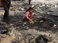 Palestinians are gathering at the site of an Israeli strike on a camp for internally displaced people in Rafah, on May 27, 2024, amid ongoin...