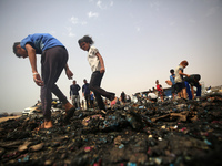 Palestinians are gathering at the site of an Israeli strike on a camp for internally displaced people in Rafah, on May 27, 2024, amid ongoin...