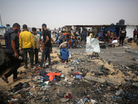 Palestinians are gathering at the site of an Israeli strike on a camp for internally displaced people in Rafah, on May 27, 2024, amid ongoin...