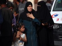 Palestinians are gathering at the site of an Israeli strike on a camp for internally displaced people in Rafah, on May 27, 2024, amid ongoin...