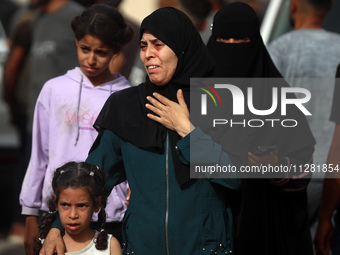 Palestinians are gathering at the site of an Israeli strike on a camp for internally displaced people in Rafah, on May 27, 2024, amid ongoin...