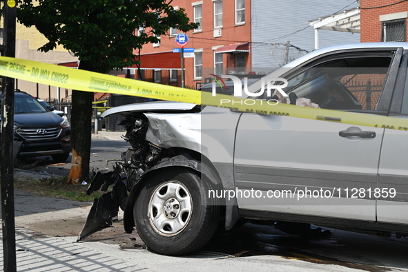 A Honda Pilot is being damaged. One person is dead after a vehicle collision following a police pursuit in Brooklyn, New York, on May 26, 20...